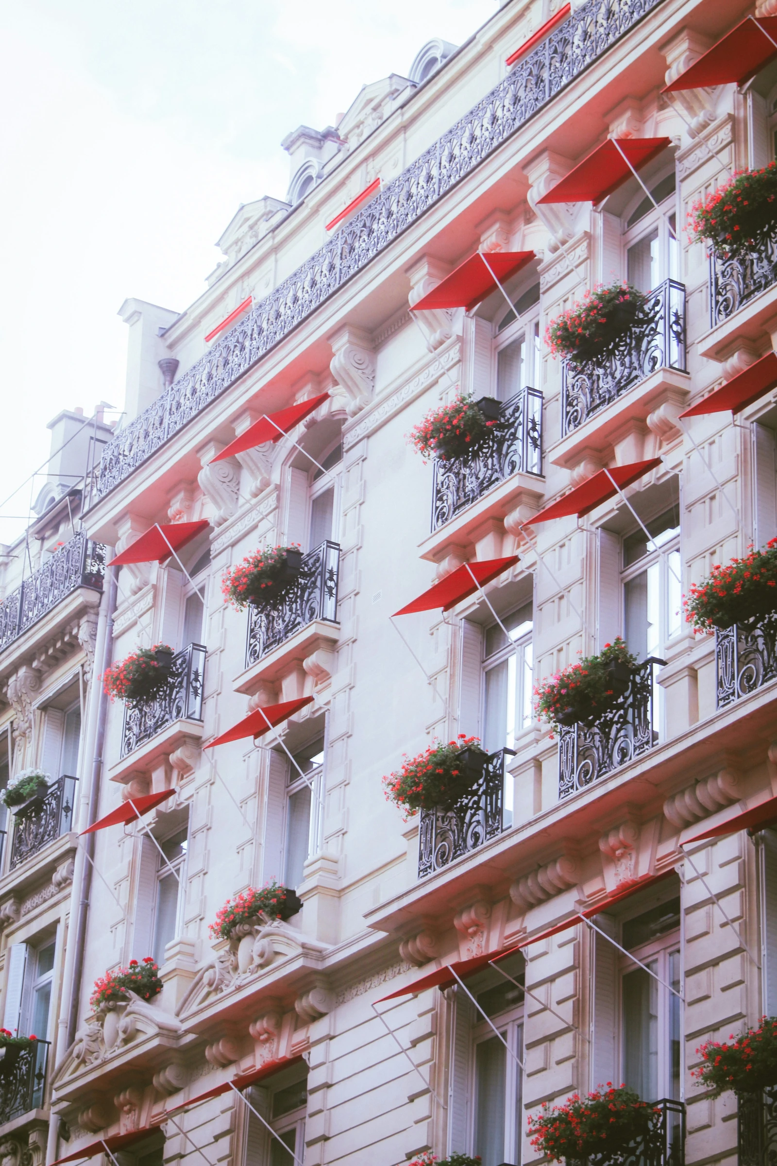 Red awnings on a Parisian fa&ccedil;ade.