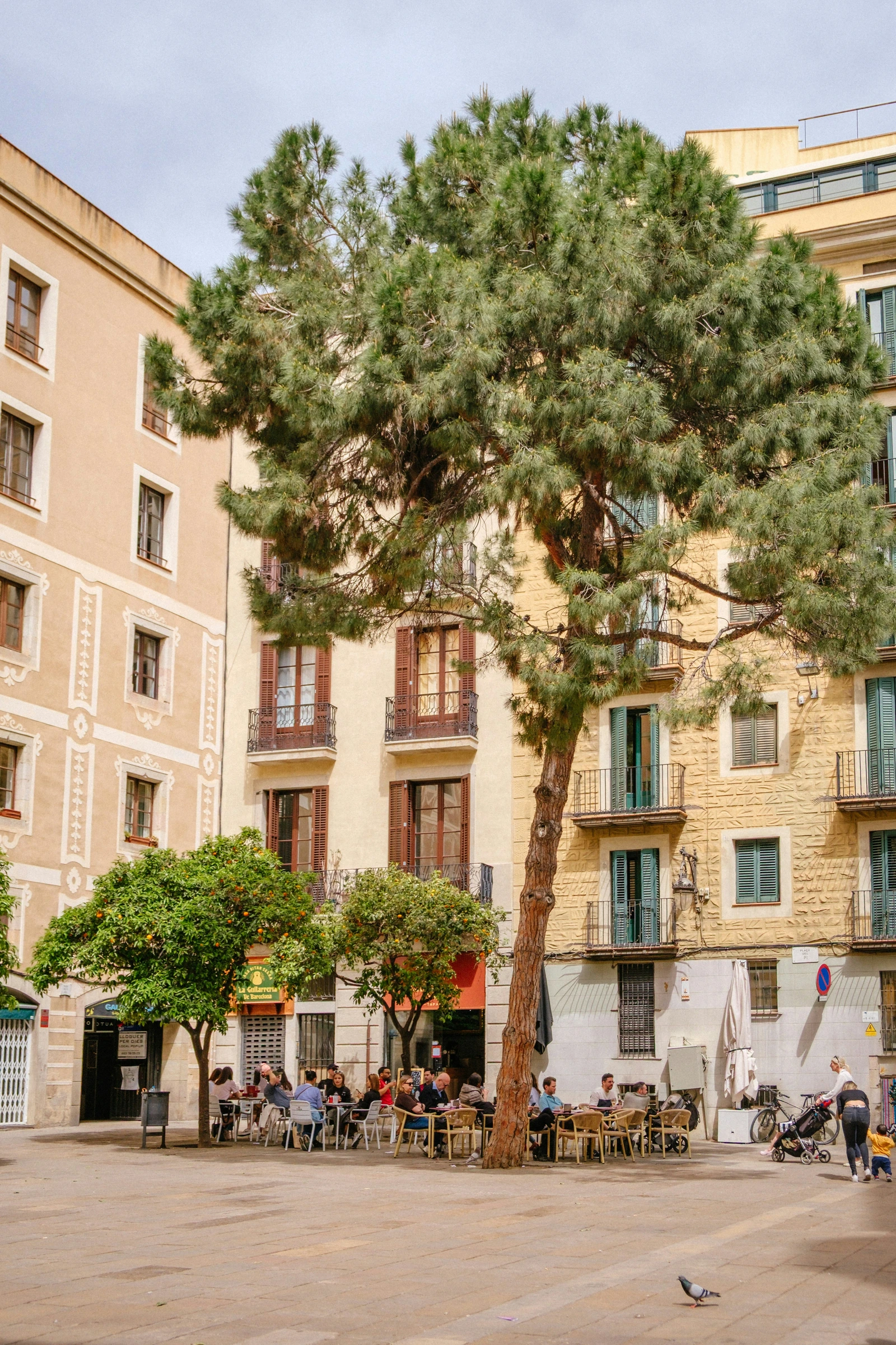 A square and caf&eacute; tables in Barcelona.