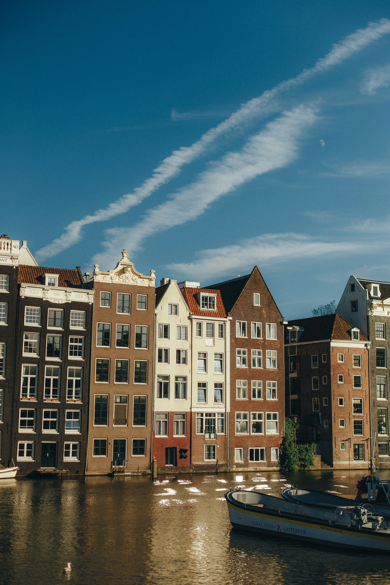 Canal-side fa&ccedil;ades in Amsterdam.
